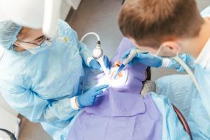 oral surgeons performing surgery on a patient