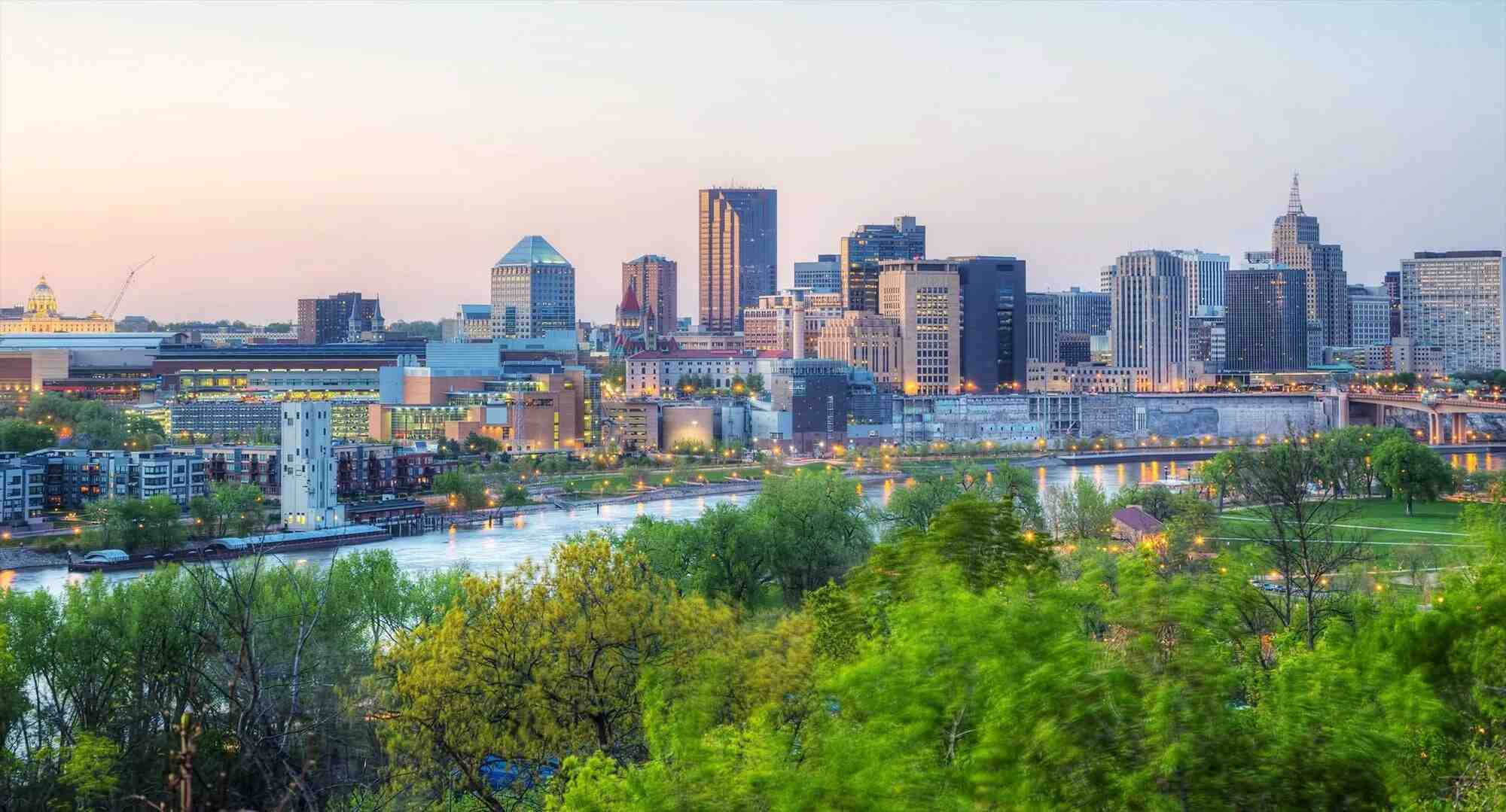 a city in Minnesota with skyscrapers and a river