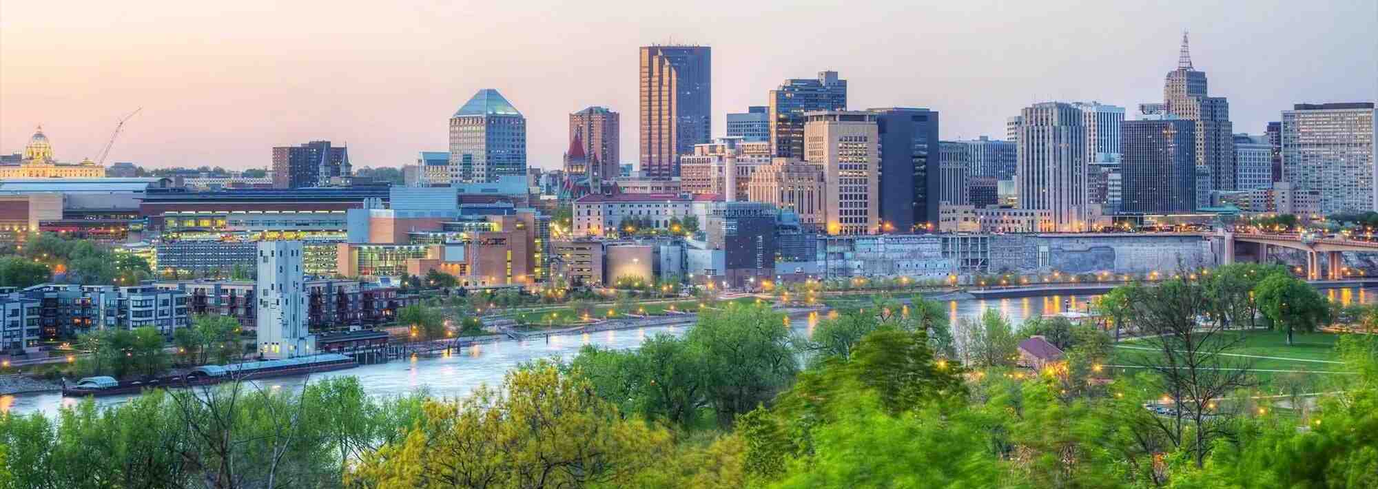 a city in Minnesota with skyscrapers and a river